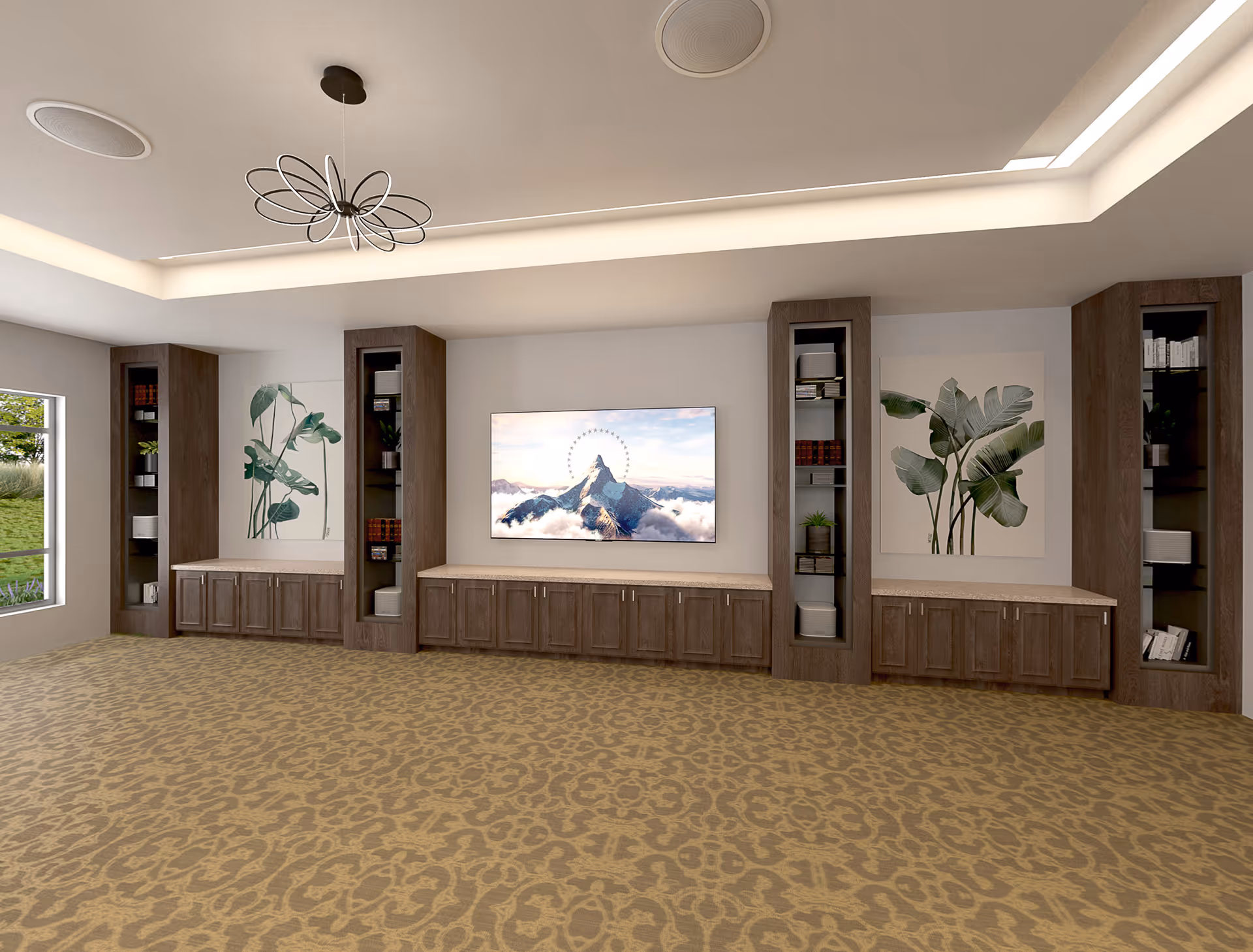 A spacious room with patterned carpet flooring, a modern ceiling light fixture, and recessed ceiling lighting. The far wall features a large flat-screen TV mounted between two large botanical prints. Below the TV and prints are wooden cabinets with open shelving containing books, plants, and decorative items. A window on the left side shows greenery outside.