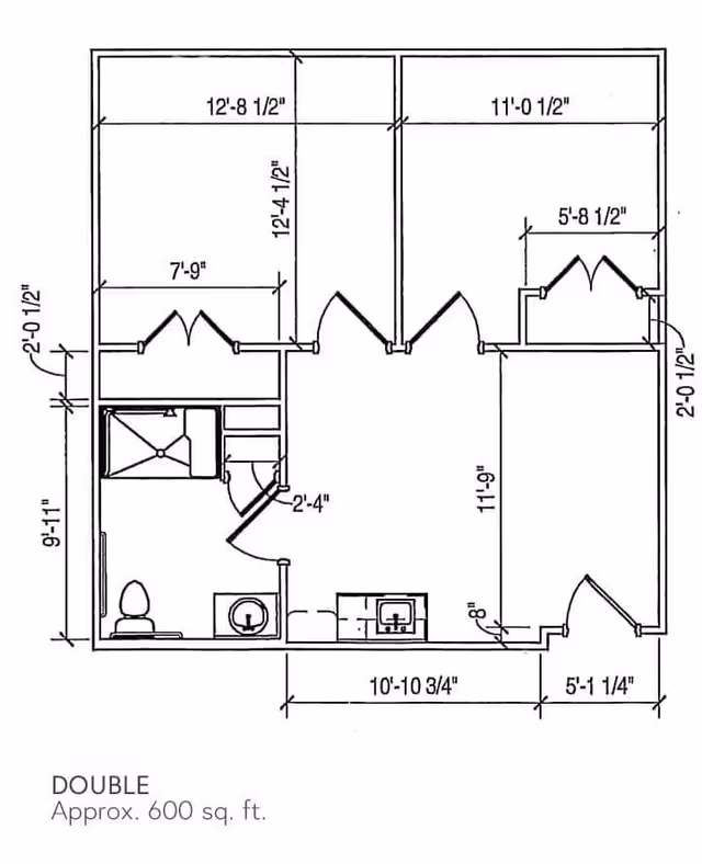 Architectural floor plan of a double unit approximately 600 square feet, showing room dimensions, bathroom with toilet and shower, kitchen area with sink, and multiple doors and closets.