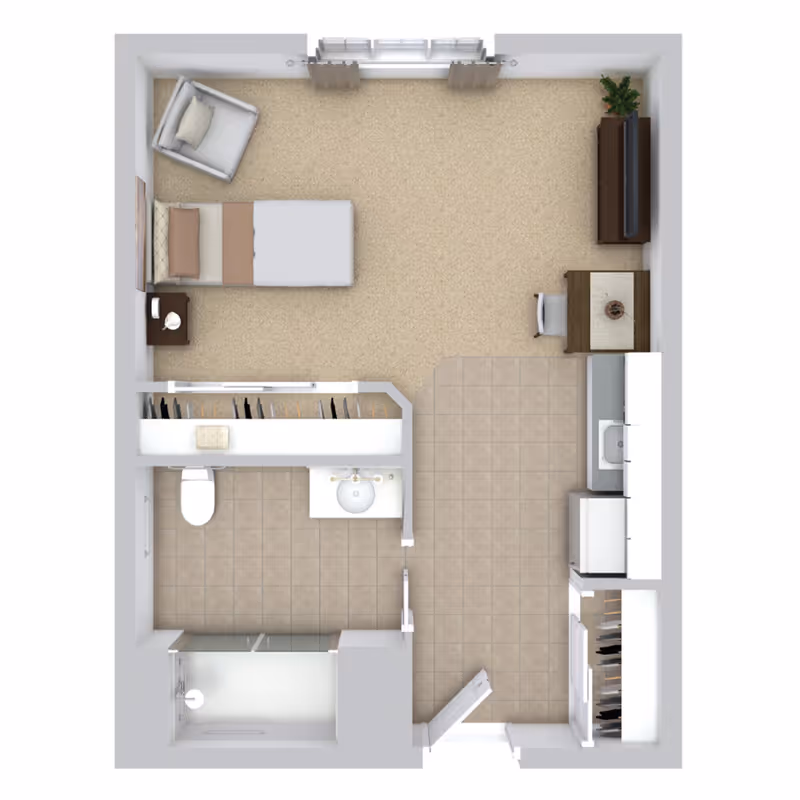 Top-down view of a small assisted living apartment floor plan featuring a bedroom area with a bed, armchair, nightstand, and TV on a dresser. There is a small dining table with a chair near the kitchen area, which includes a sink, refrigerator, and cabinets. The bathroom has a toilet, sink, and shower. There is also a closet space adjacent to the bathroom.