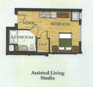 Floor plan of an assisted living studio apartment showing a foyer, bathroom with shower, toilet and sink, a closet, and a bedroom area with a bed and two nightstands. The kitchen area is along one wall of the bedroom.