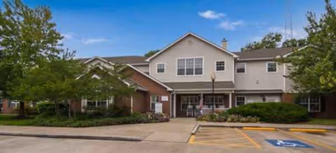 Exterior view of Brookdale the Heights senior living facility front entrance with parking.