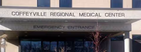 Exterior view of Coffeyville Regional Medical Center entrance with Emergency Entrance signage.
