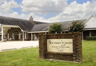 Exterior view of Southern Knights Senior Living Center with a brick sign at the entrance.