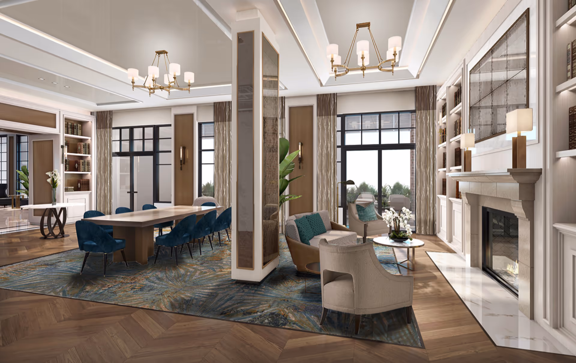 A spacious and elegant living and dining area with a large wooden dining table surrounded by blue upholstered chairs on a patterned rug. The living area features comfortable beige armchairs and a sofa with teal cushions, a round coffee table with a floral arrangement, and a stone fireplace with a large mirror above it. The room has large windows with curtains, built-in bookshelves, and modern chandeliers hanging from a coffered ceiling.