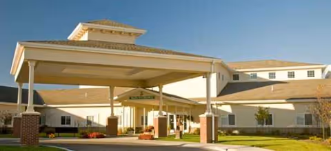 Front view of Brookdale Overland Park facility with covered entrance and drive-up drop-off