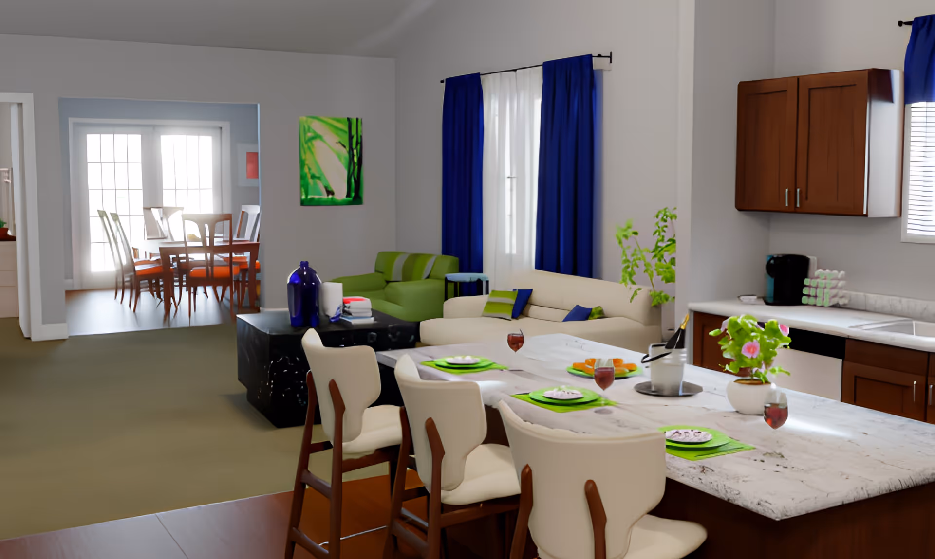 Open-plan interior showing a kitchen island set for dining, a nearby living area with sofas and blue curtains, and a dining room visible in the background.