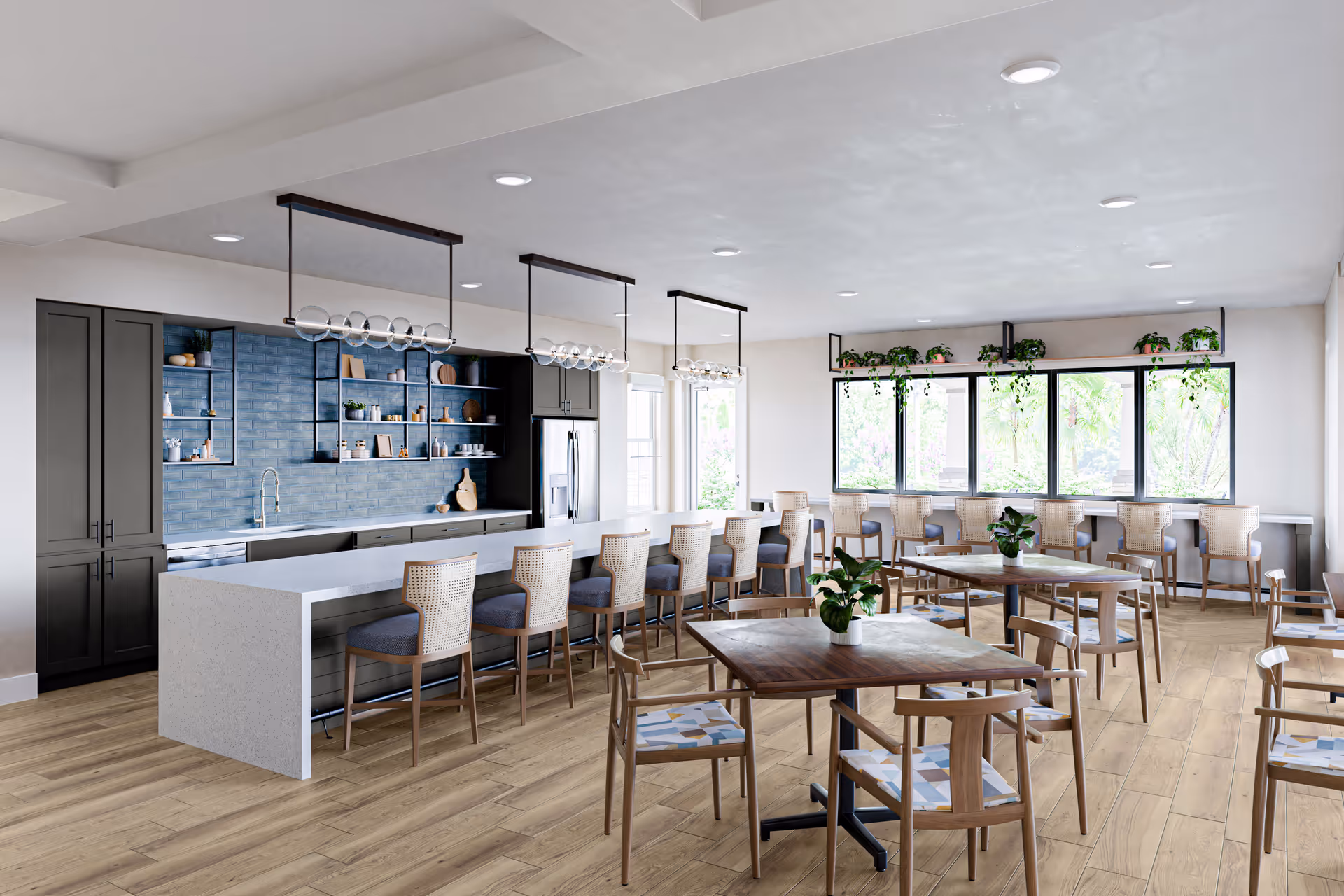 A bright and modern dining area with a long kitchen island featuring bar stools, wooden tables with chairs, large windows with hanging plants, and a blue tiled backsplash in the kitchen area.