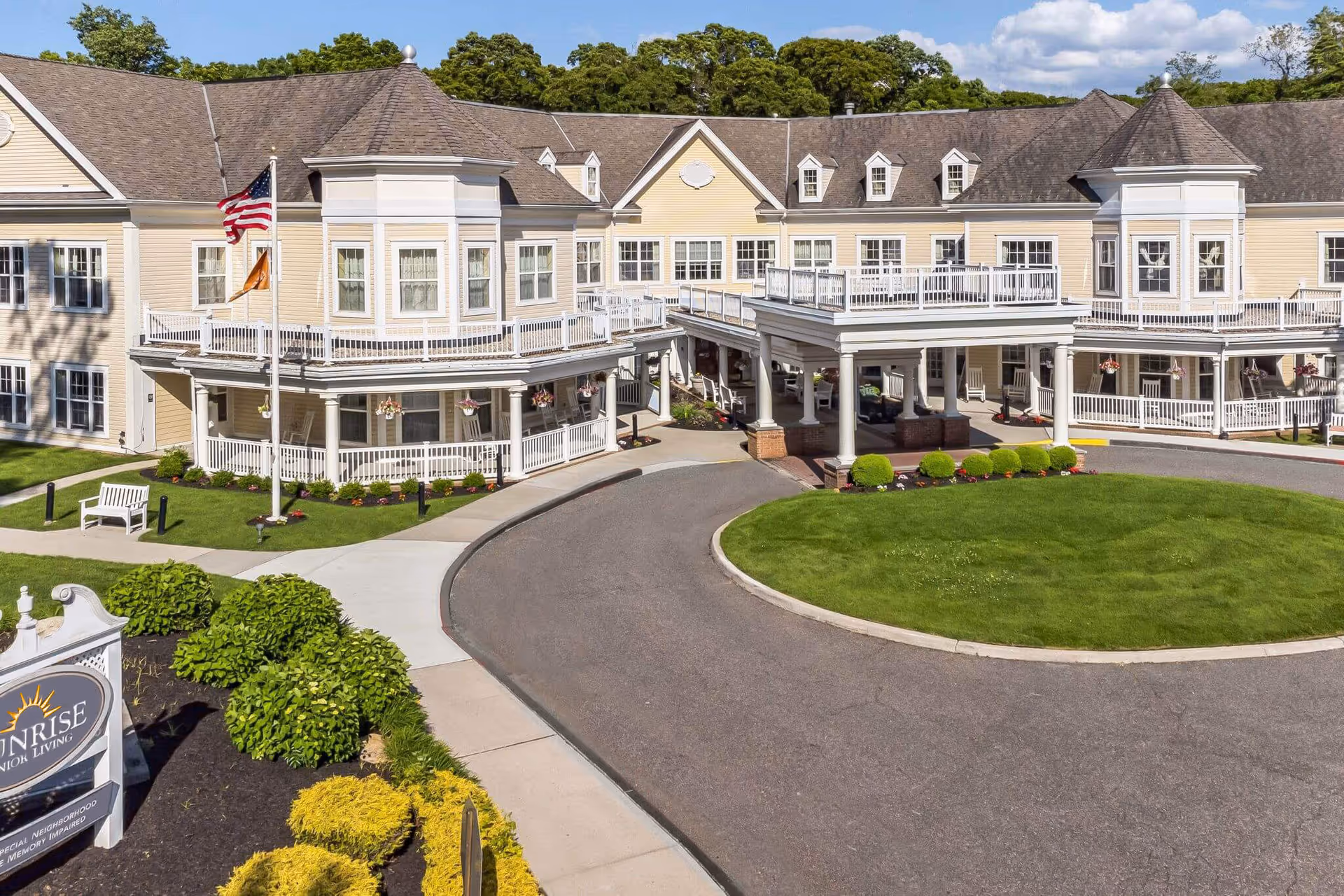 Exterior view of Sunrise of East Setauket with circular driveway and entrance.