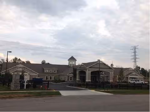 Exterior view of The Lantern at Morning Pointe Alzheimer's Center entrance and parking.