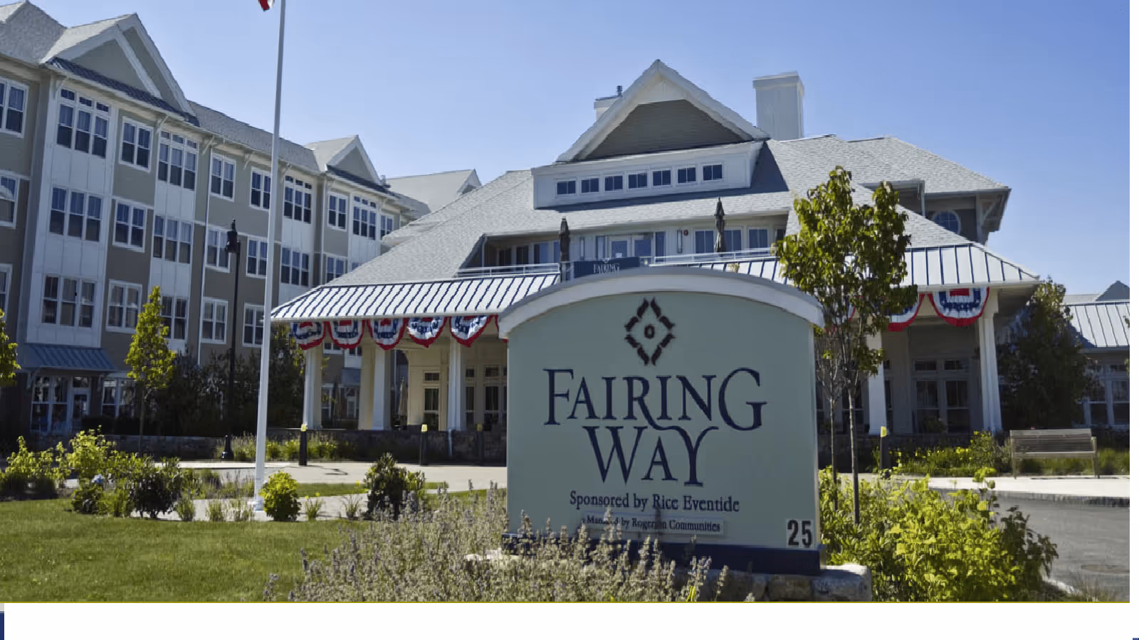 Front exterior of the Fairing Way independent living community building with its entrance sign in the foreground.