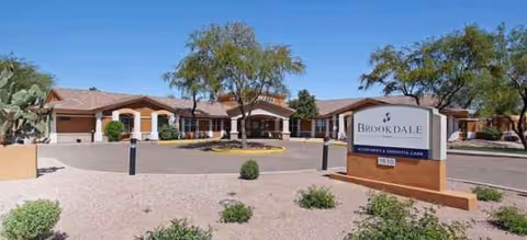 Front view of Brookdale Tempe senior living facility with a sign and landscaped entry.