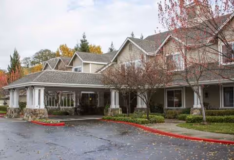 Sunrise of Danville senior living facility exterior with entrance and landscaped front.
