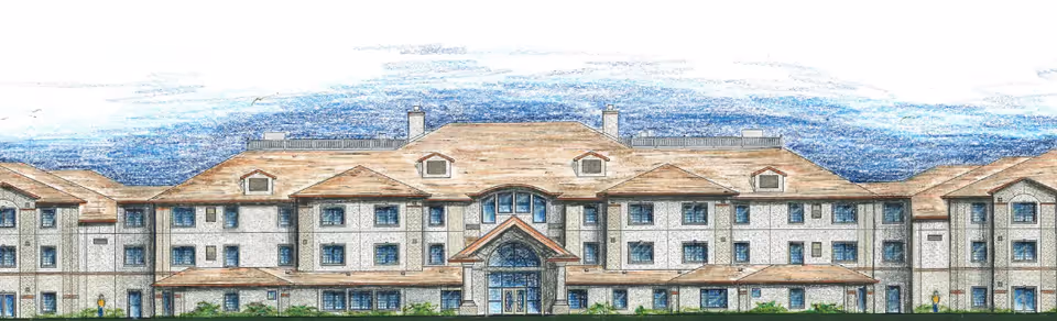 Illustrated front exterior view of a large multi-story senior living facility building with multiple windows, peaked roofs, and a central entrance under a covered porch.