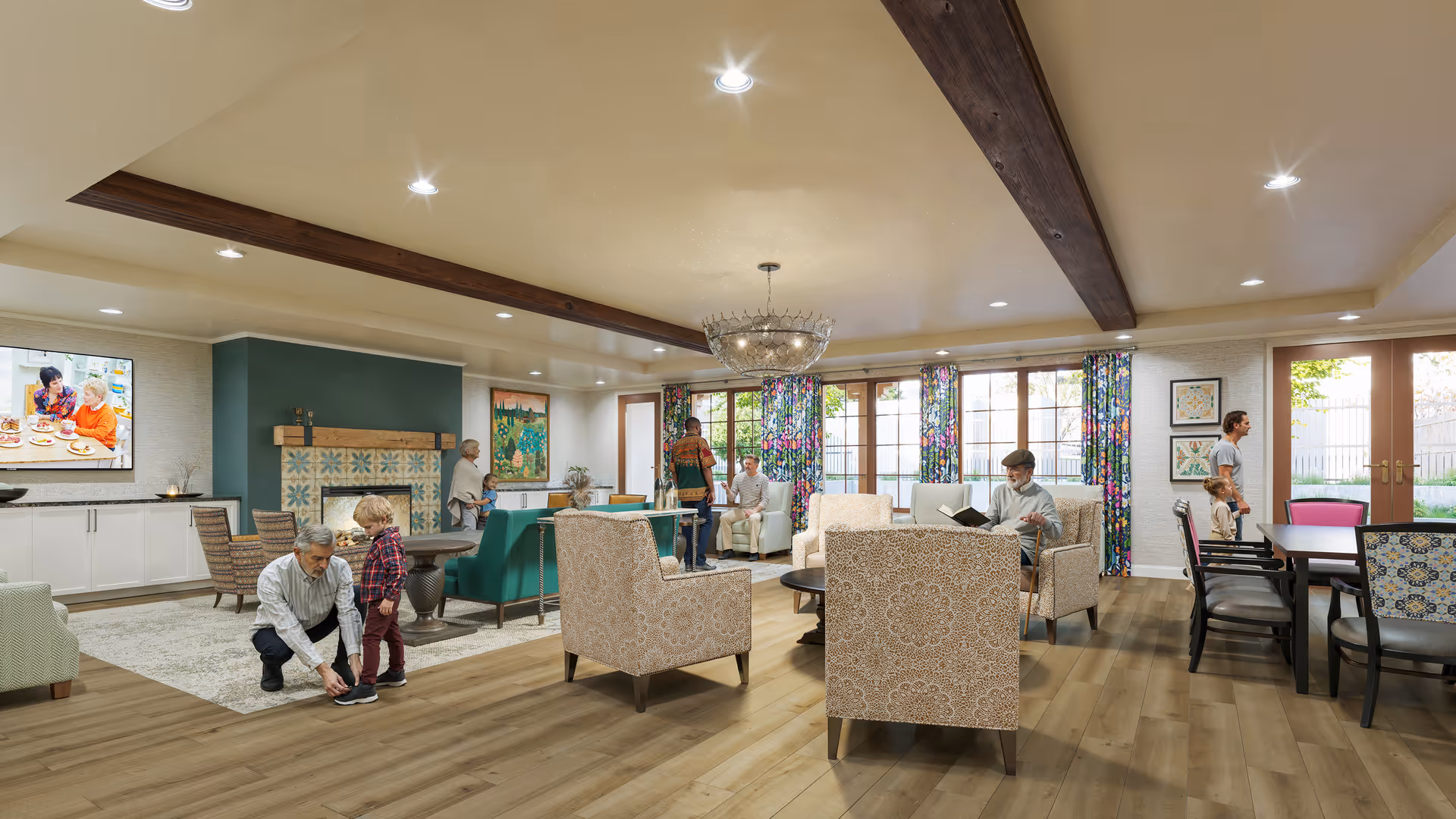 A spacious and well-lit living room area in a senior living facility with wooden beams on the ceiling, a large chandelier, patterned armchairs, and a fireplace with decorative tiles. Several seniors and children are interacting and relaxing in the room, with large windows and floral curtains letting in natural light. A television is mounted on the wall, and there is a dining table with chairs on the right side near glass doors leading outside.