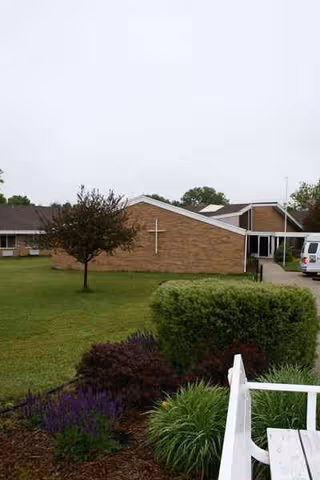 Exterior view of Mount Joseph Senior Village with brick building and landscaping