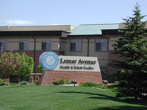 A front lawn and sign reading 'Lemay Avenue Health & Rehab Facility' with the facility building behind it.