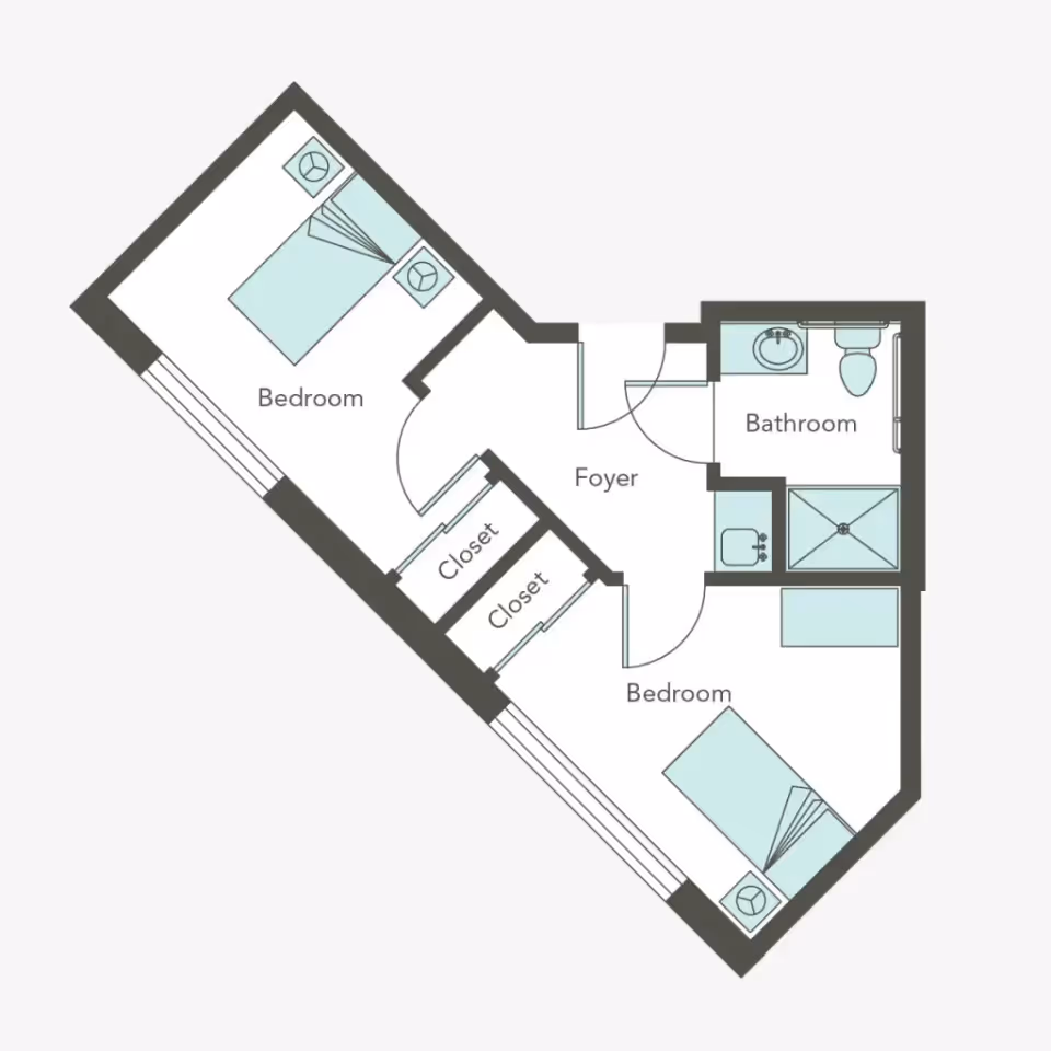 Floor plan of a living space at Aegis Living Ballard showing two bedrooms, a bathroom, a foyer, and two closets. Each bedroom contains a bed and a nightstand. The bathroom includes a sink, toilet, and shower.