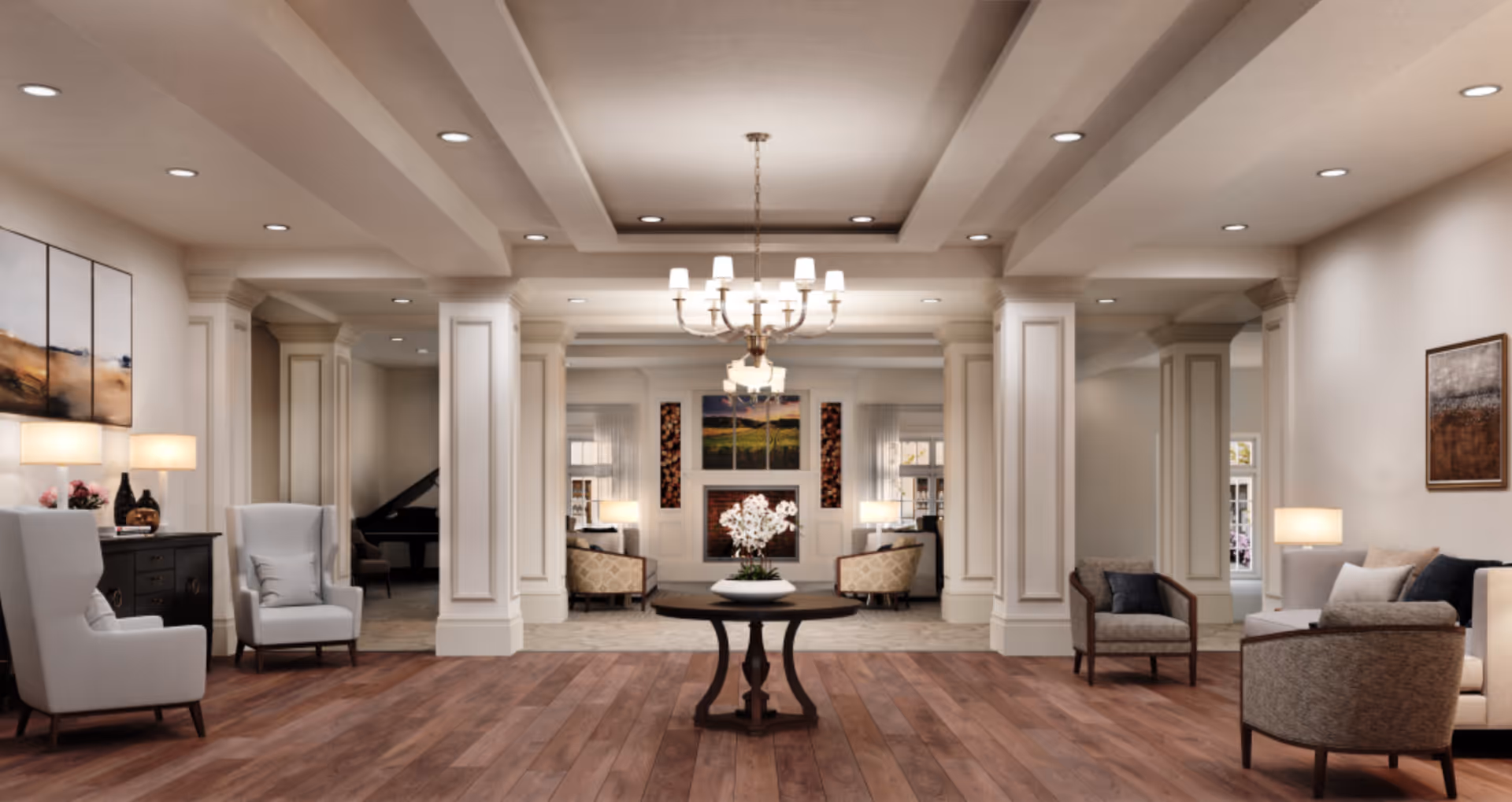 Spacious elegant lounge with armchairs, sofas, columns, a central round table, chandelier, and wood floors.