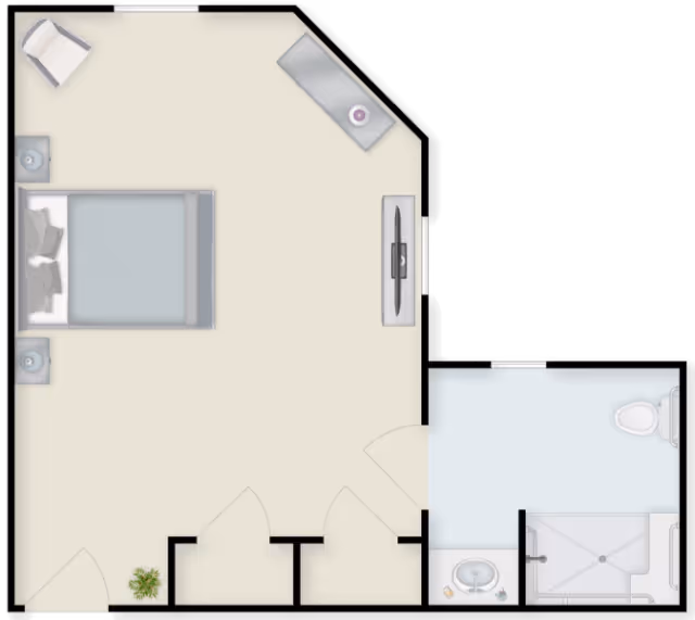 Top-down floor plan of a studio-style bedroom showing a bed, nightstands, TV, seating area, closets and an adjacent bathroom with sink, shower and toilet.