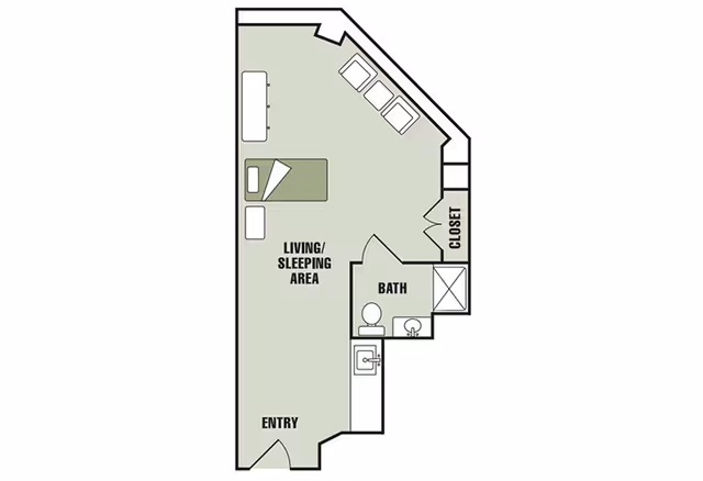 Floor plan of a studio apartment at HeartFields at Cary showing an entry area, a combined living and sleeping area with a bed, sofa, and chairs, a bathroom with a toilet, sink, and shower, and a closet.