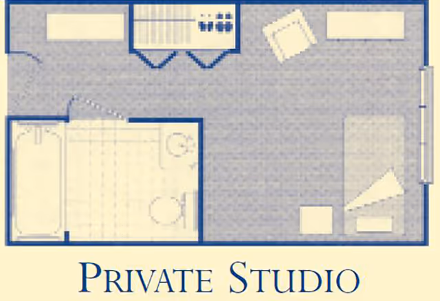 Floor plan labeled 'Private Studio' showing a single-room layout with a bed, seating area, kitchenette/closet, and a separate bathroom.