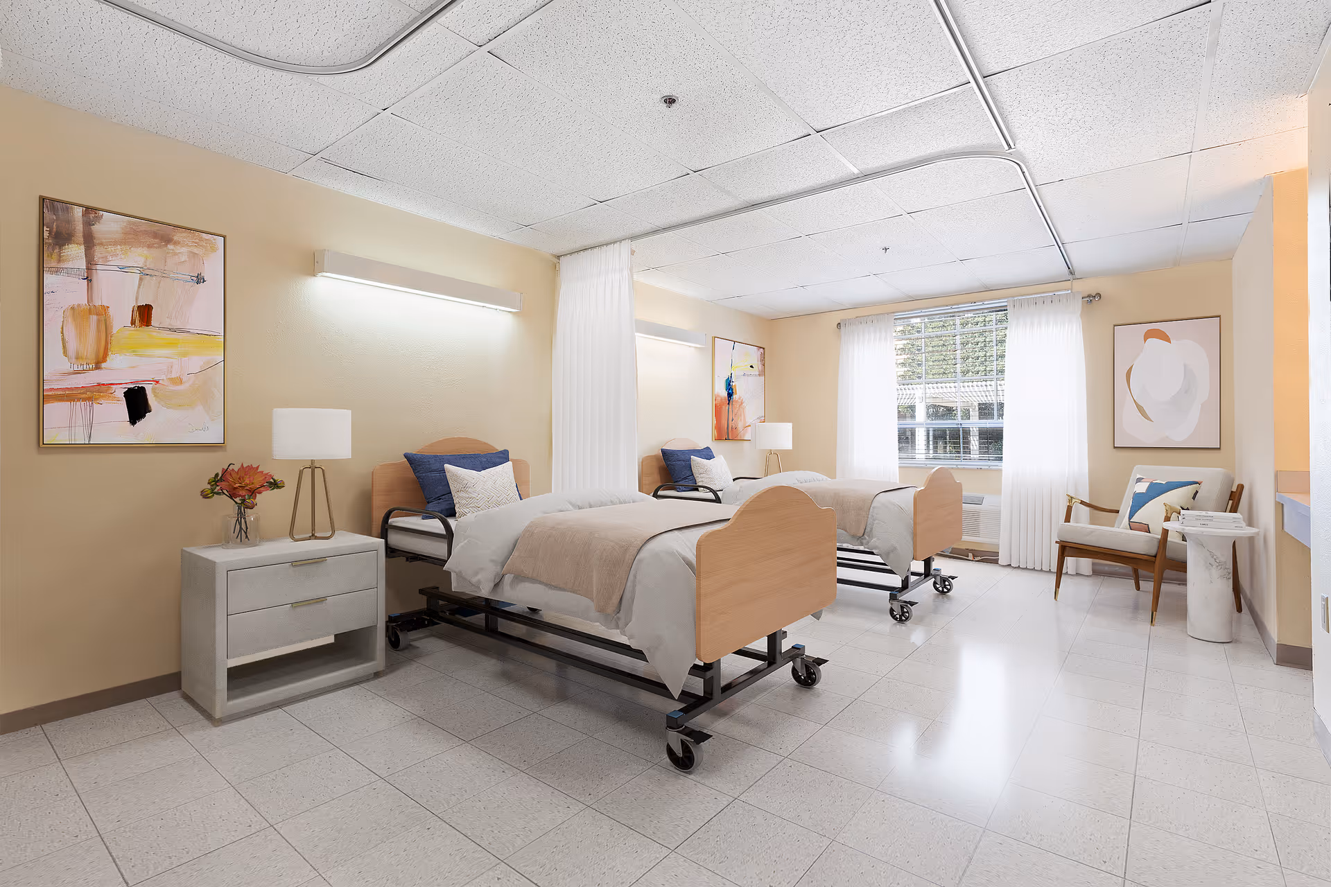 Bright shared senior care bedroom with two adjustable beds, nightstand, chair and window.