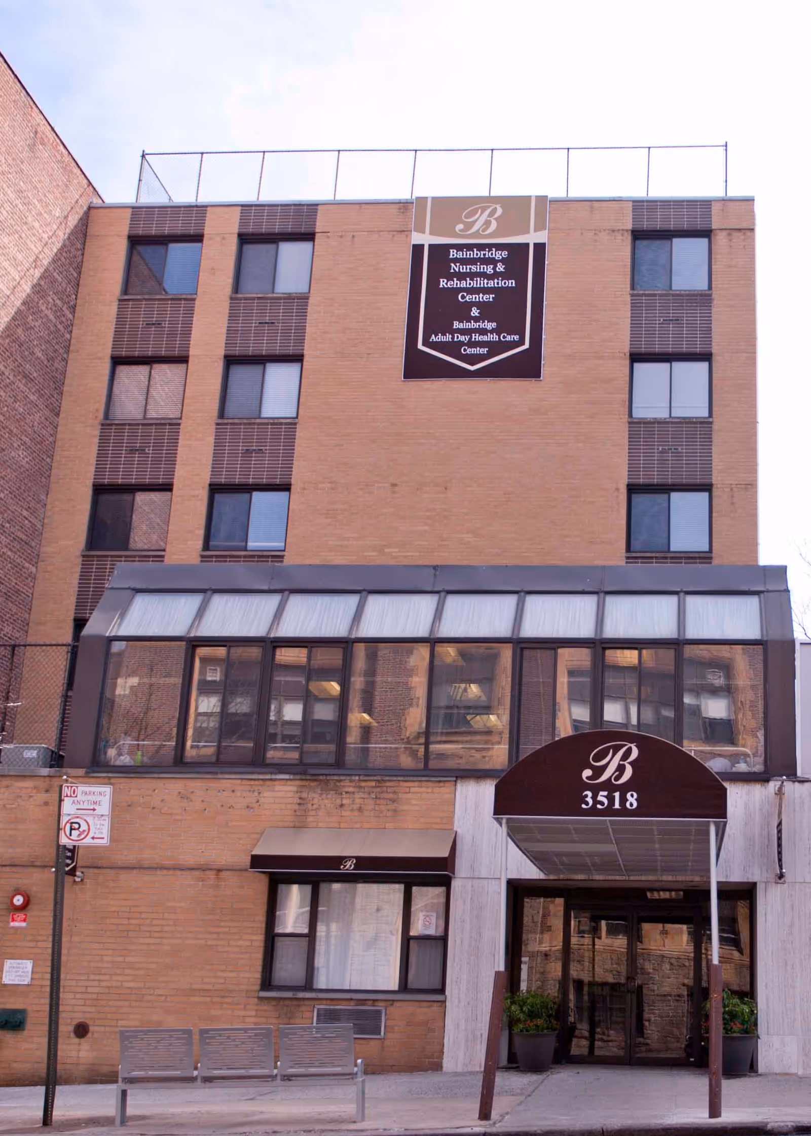 Multi-story brick nursing home building front with a canopy entrance and signage reading Bainbridge and 3518.