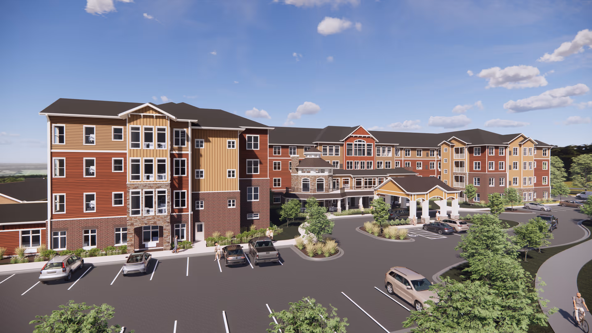 Exterior view of a multi-story senior living building with a covered entrance, parking lot, cars and landscaped grounds under a blue sky.
