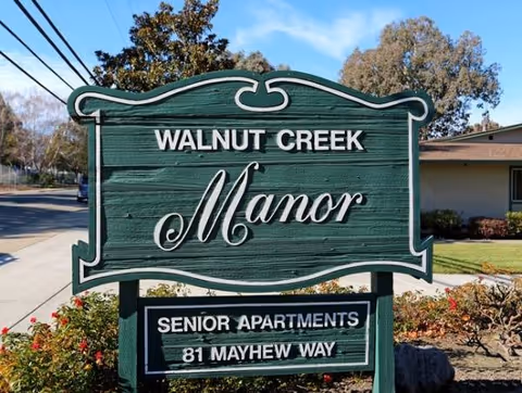 Walnut Creek Manor outdoor sign advertising Senior Apartments at 81 Mayhew Way