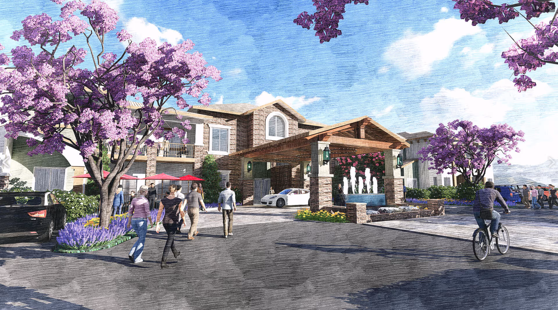 Front entrance of a senior living facility with people walking, purple flowering trees, a covered porte-cochère and a fountain.