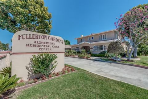 Exterior view of Fullerton Gardens Alzheimer's Residential Care Center entrance and sign.