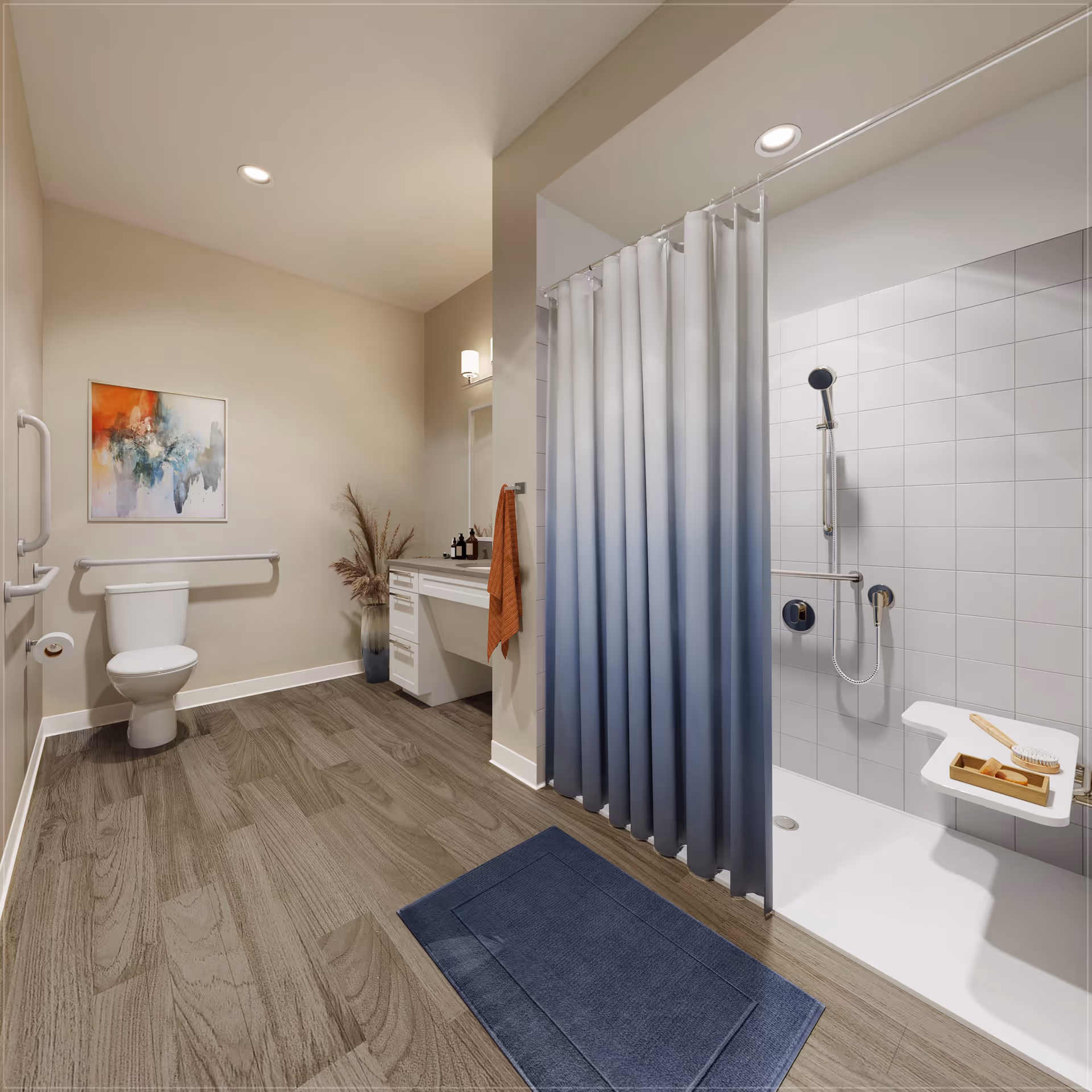 A spacious, modern bathroom with wood-look flooring, a white toilet with grab bars, a vanity with a mirror and countertop, a blue gradient shower curtain, and a walk-in shower equipped with a handheld showerhead and a fold-down seat. There is a blue bath mat on the floor and a colorful abstract painting on the wall.