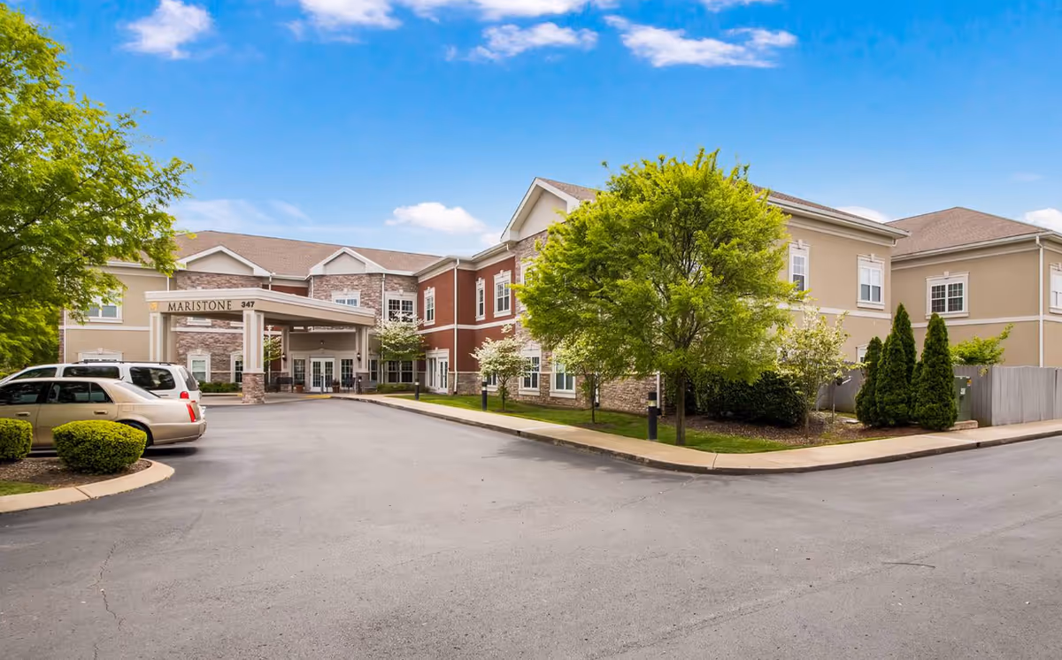 Front exterior view of Maristone of Franklin with entrance, trees, and parking.
