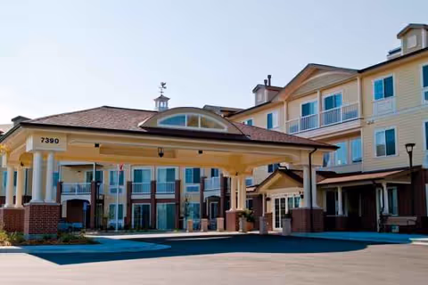 Exterior view of Lakeview Senior Living with covered entrance and multi-story building