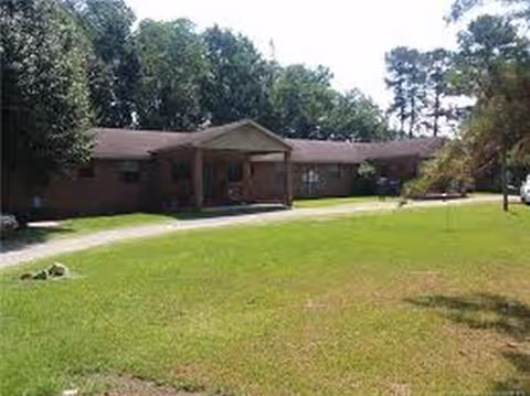 Front exterior of B&B Assisted Living 2, a single-story brick building with a covered entrance.