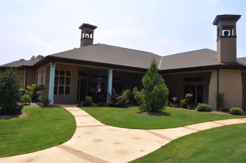 Front view of Hamilton Mill Senior Care building with curved path and manicured lawn