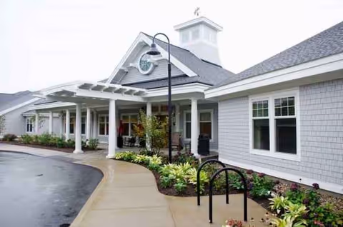 Exterior view of Bridges by EPOCH at Mashpee entrance with walkway and landscaping