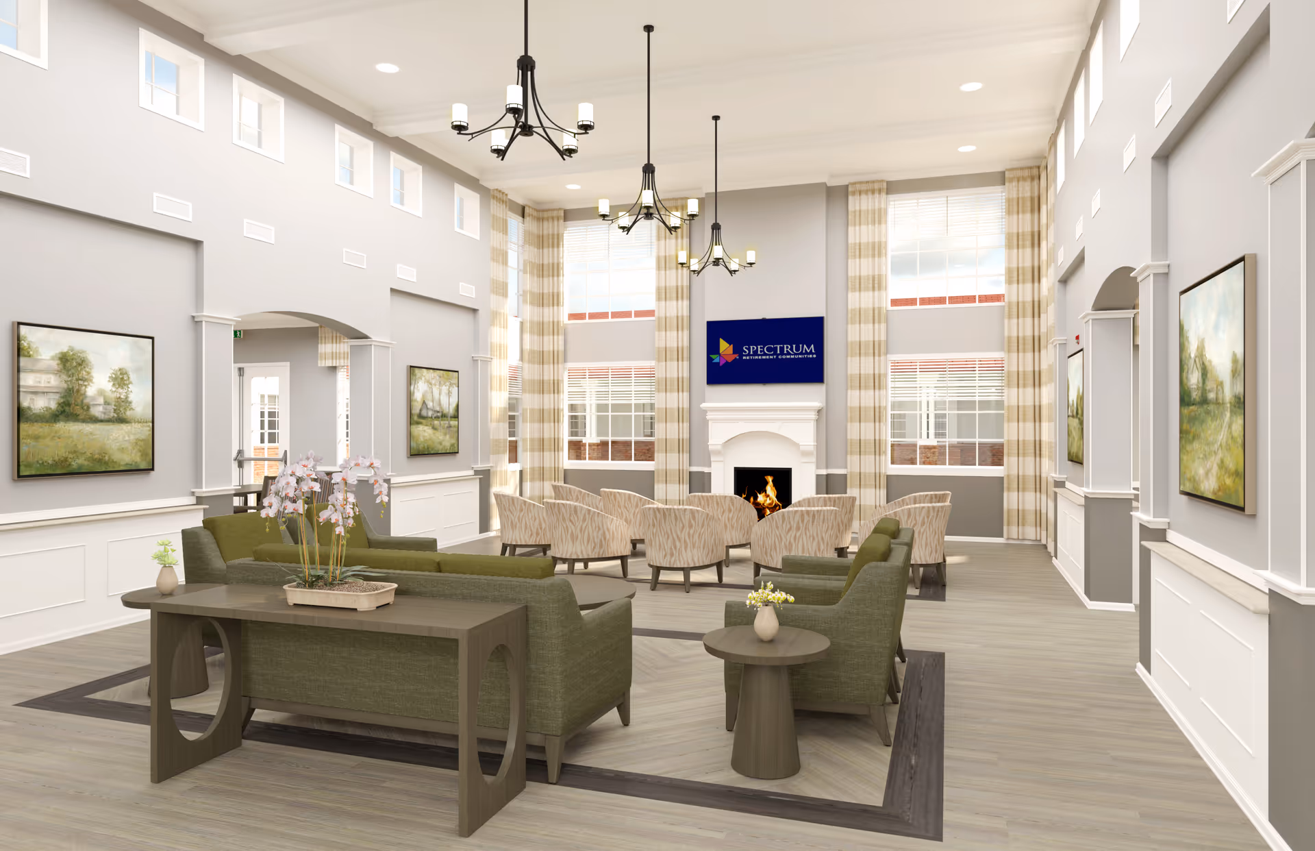 A spacious and well-lit senior living common area with high ceilings and large windows. The room features a fireplace with a TV mounted above it, surrounded by beige patterned curtains. There are multiple comfortable seating options including green sofas and beige armchairs arranged around the fireplace. The walls are decorated with landscape paintings, and the floor is covered with light wood flooring. Modern chandeliers hang from the ceiling, adding to the elegant ambiance.