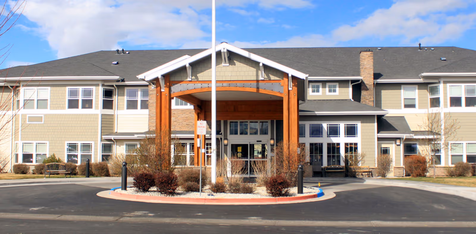 Exterior view of Montage Creek a Generations Community with covered entrance and landscaped approach.