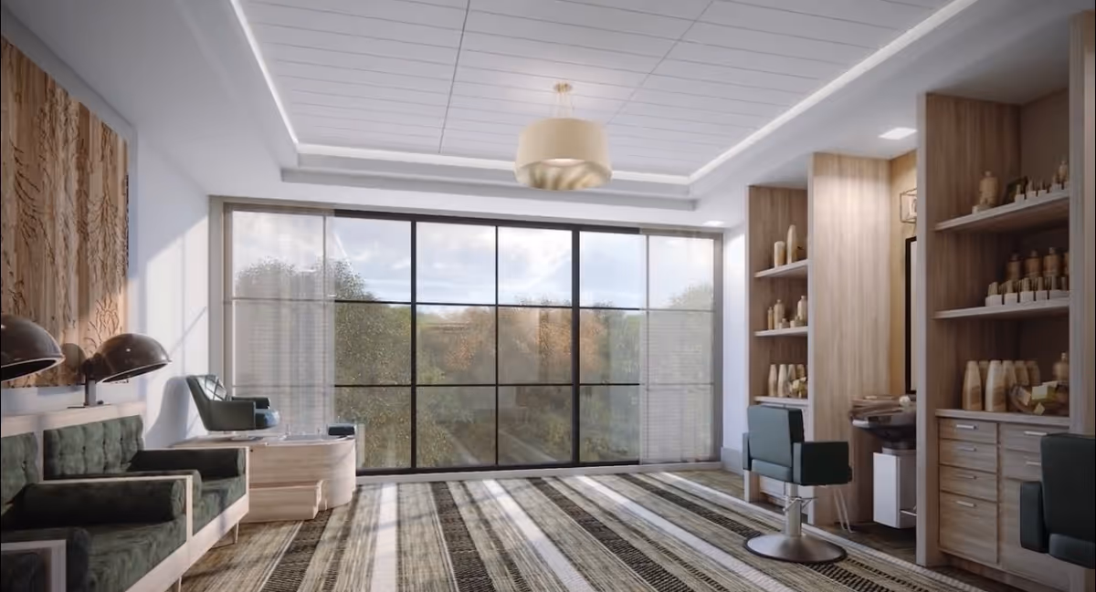 Bright modern salon-style common room with large floor-to-ceiling windows, seating, styling chairs, and wooden shelving.