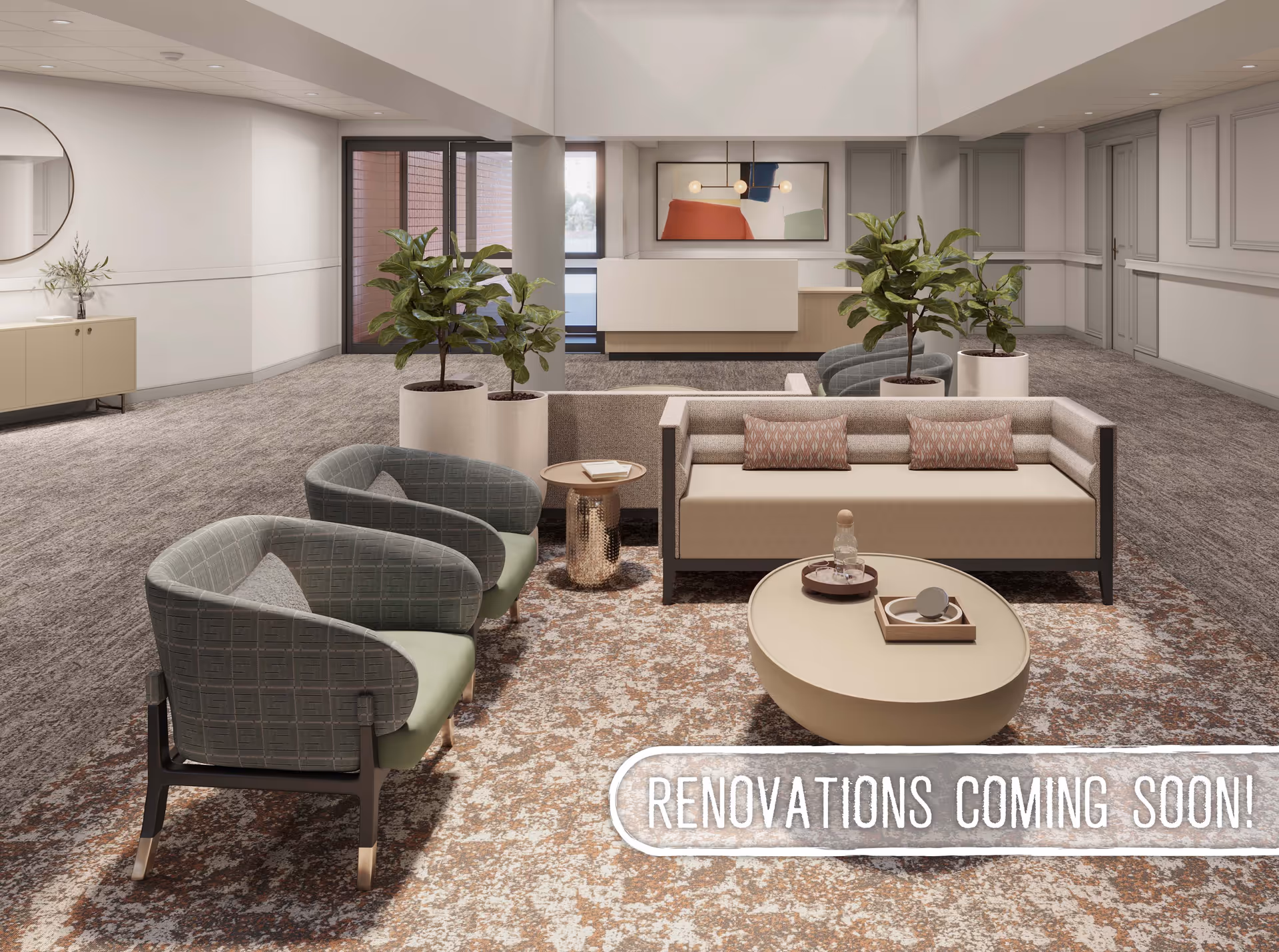 A modern senior living facility common area with a beige sofa, two green armchairs, a round coffee table, and two side tables. There are two large potted plants behind the sofa, a console table with a round mirror on the left wall, and a reception desk in the background. The carpet has a patterned design, and a sign on the floor reads 'RENOVATIONS COMING SOON!'