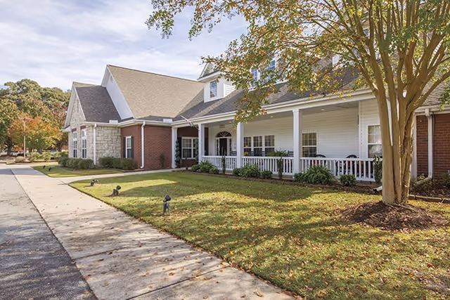 Exterior view of Navion of Goldsboro senior living facility with front porch.