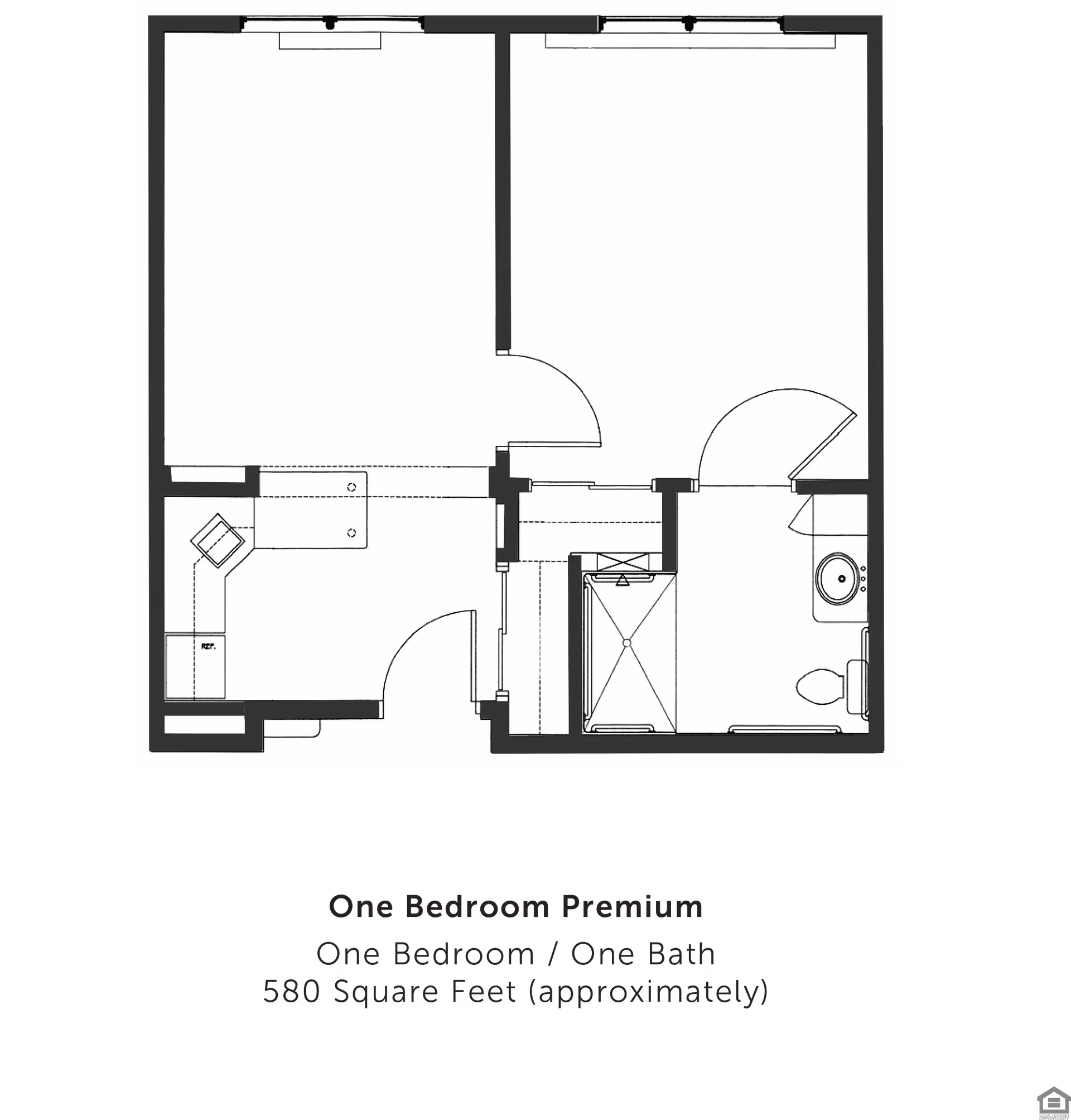 Floor plan layout of a one bedroom premium apartment with one bathroom, approximately 580 square feet. The plan shows a bedroom, bathroom with shower, toilet and sink, a kitchen area with refrigerator and counter space, and a living area.