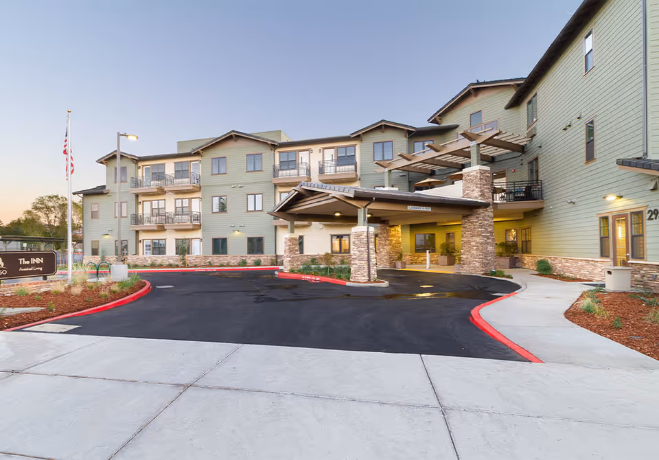 Exterior view of Westmont of Chico The Inn entrance with porte-cochere and parking