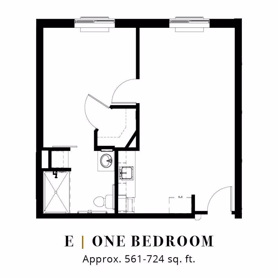 Floor plan layout of a one-bedroom apartment labeled E, approximately 561 to 724 square feet, showing a bedroom, bathroom with shower, toilet and sink, and a living area with kitchen fixtures.