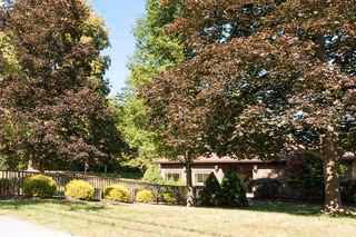 Exterior view of Twilight Gardens facility with trees and landscaping