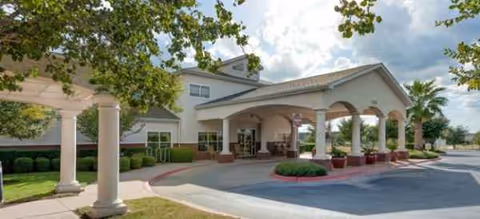 Front entrance of Parmer Woods at North Austin with a covered porte-cochere.