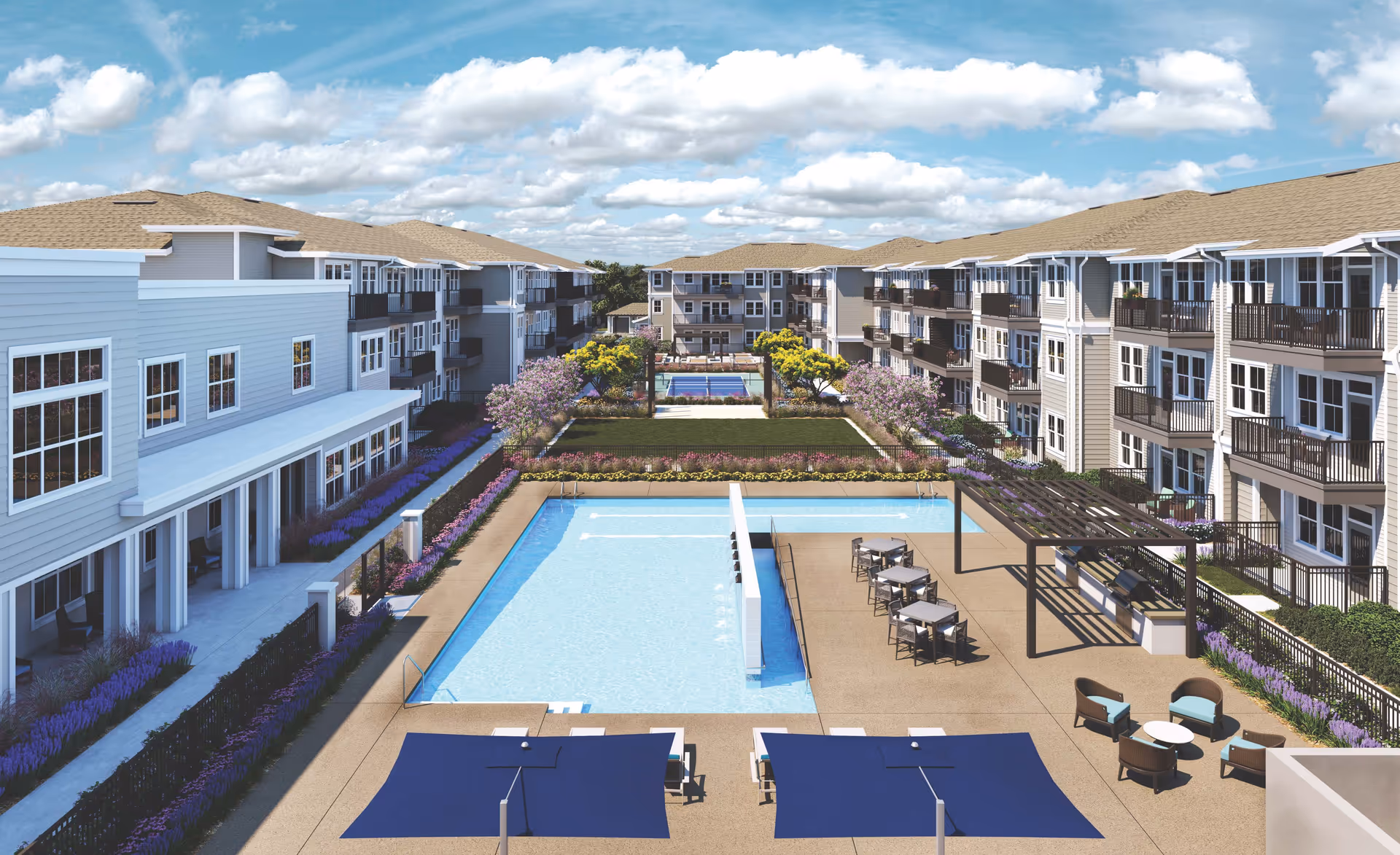 Outdoor courtyard with a central swimming pool, poolside seating and shade structures flanked by multi-story apartment buildings with balconies.