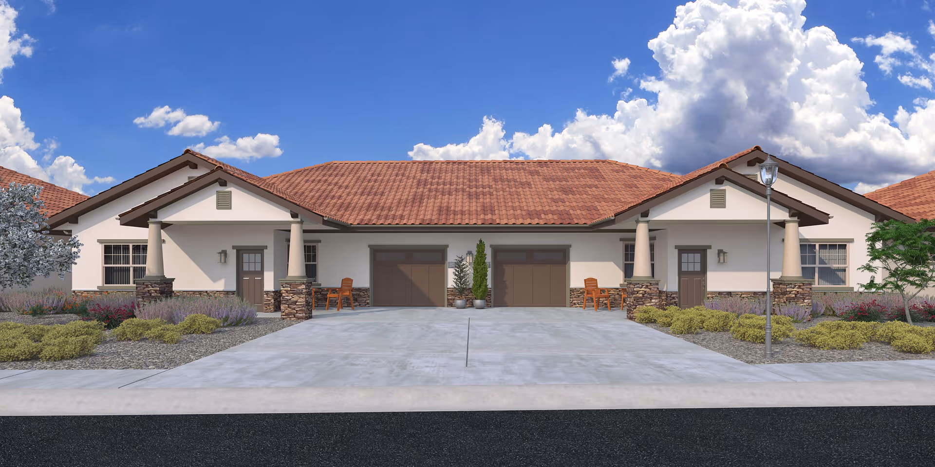 Single-story Mediterranean-style building with a red tiled roof, two garage doors, a wide driveway and landscaped front with seating under a blue sky.