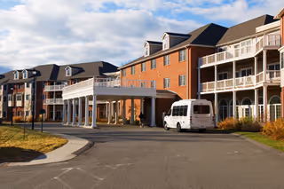 Exterior view of The Wellington at Springfield with brick building and white entrance canopy.